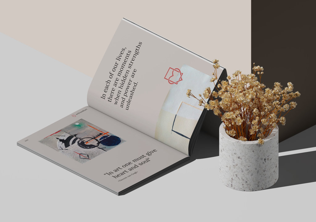 Open Artfromdhart brochure beside dried flowers