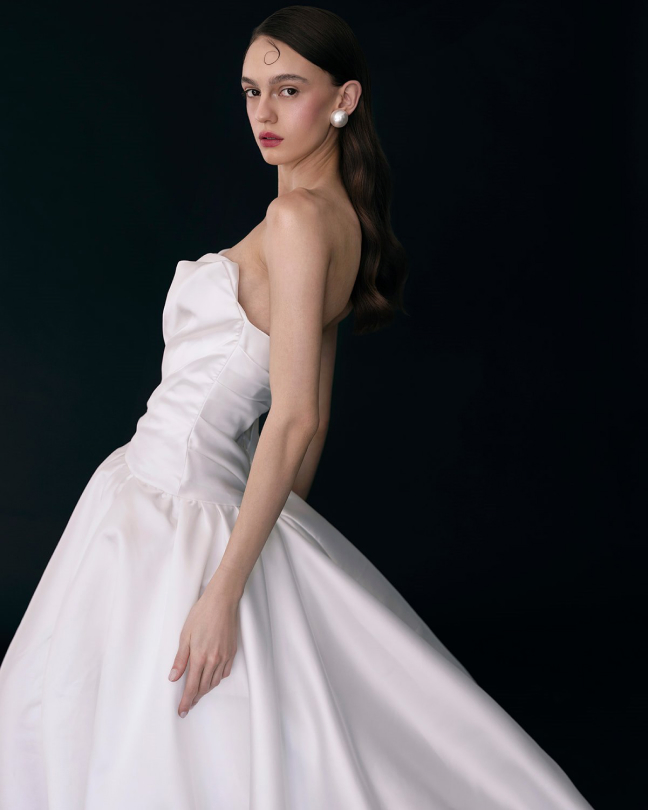 Post: a wedding dress photographed on black