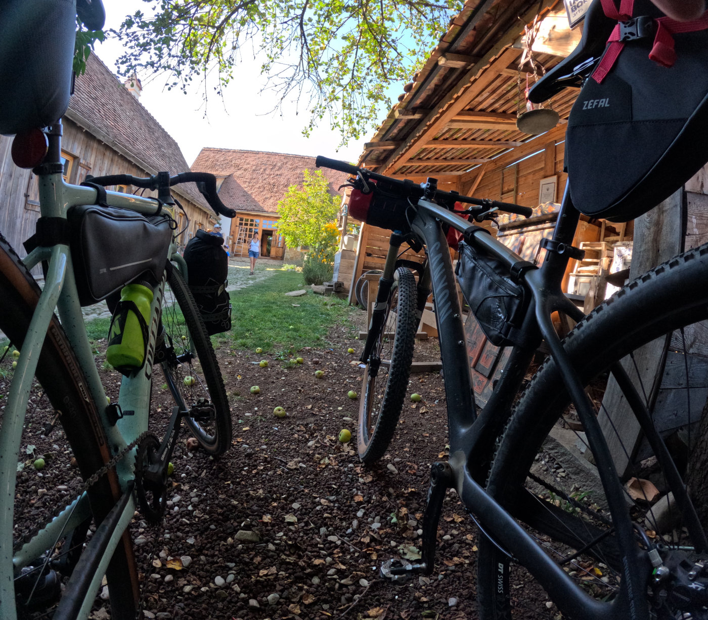 Loaded gravel bikes outside a village guesthouse